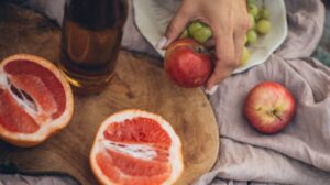 crop-woman-having-fresh-healthy-snack | 16 Best Snacks for Weight Loss | Featured