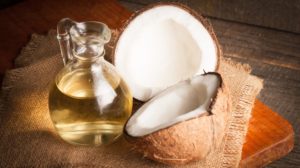 ripe-half-cut-coconut-on-wooden | Unexpected Benefits Of Coconut Oil | featured