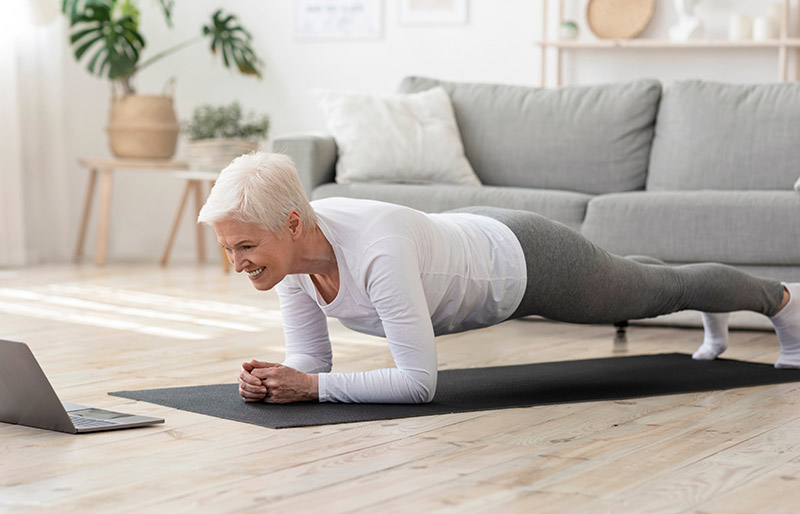 domestic training active senior woman making | easy core exercises for seniors