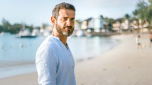 IhuHLIxS_Tk man standing on beach during daytime photo | How To Look Younger | Skincare Tips For Men Over 50 | Featured