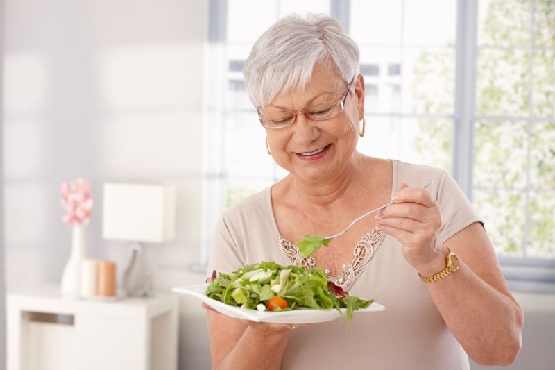happy-old-lady-eating-fresh-green Diet For Women Over 60 