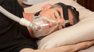 man sleeping apnea cpap machine | Sleep Apnea Surgery FAQs | Featured