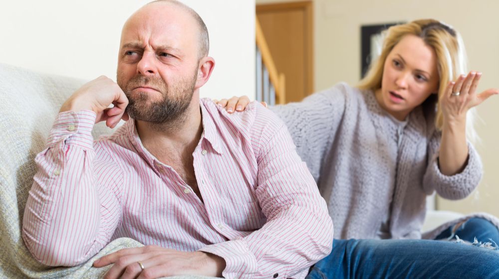 unpleased-man-woman-during-quarrel-living Arguments Couples Have And How To Fix Them | Featured