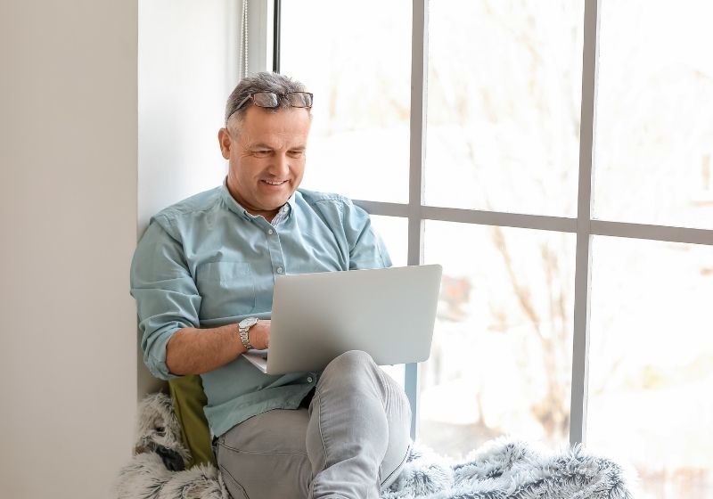 Mature man using laptop at home When you turn 50 SS