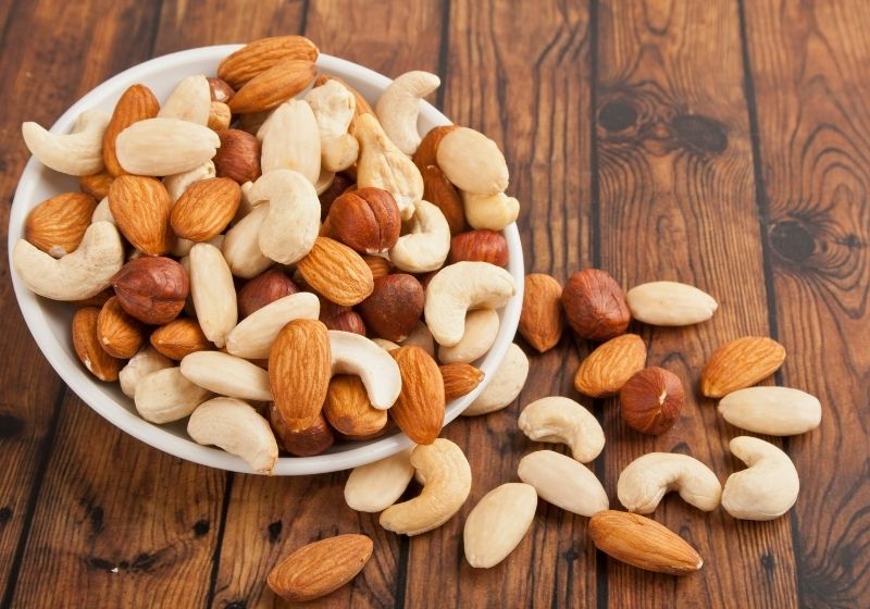 Mixed nuts in white bowl When you turn 50 SS