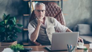 Portrait of confident serious strict concentrated pensive qualified smart clever self-assured head of a company dressed-ss-featured