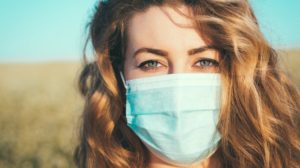 close-up portrait of a woman in a medical mask | COVID Survival Guide | Lifestyle Changes To Lower Metabolic Risk | featured