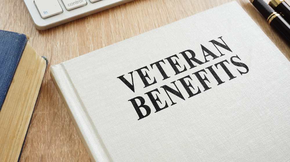 Book about Veteran Benefits on a desk | How To Secure VA Benefits For Senior In-Home Care | Featured