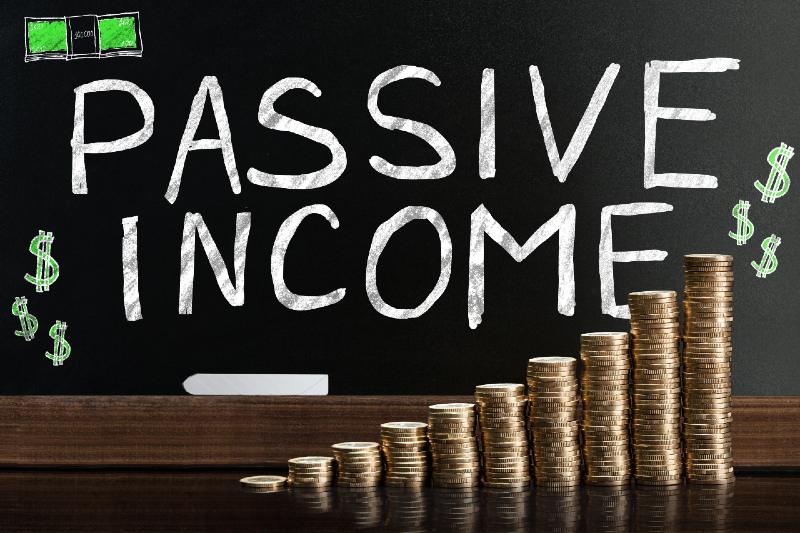 Passive Income Word On Blackboard Behind Stacked Coins | How To Make Passive Income?