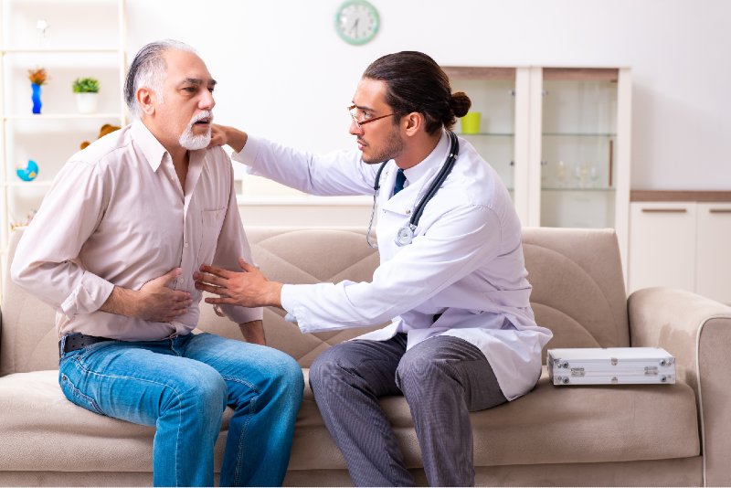 Young male doctor visiting old patient at home-Health Issues of Retirees