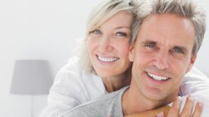 affectionate couple smiling camera home bedroom | California Has a Master Plan for Aging. Now What? | Money & Policy | Featured