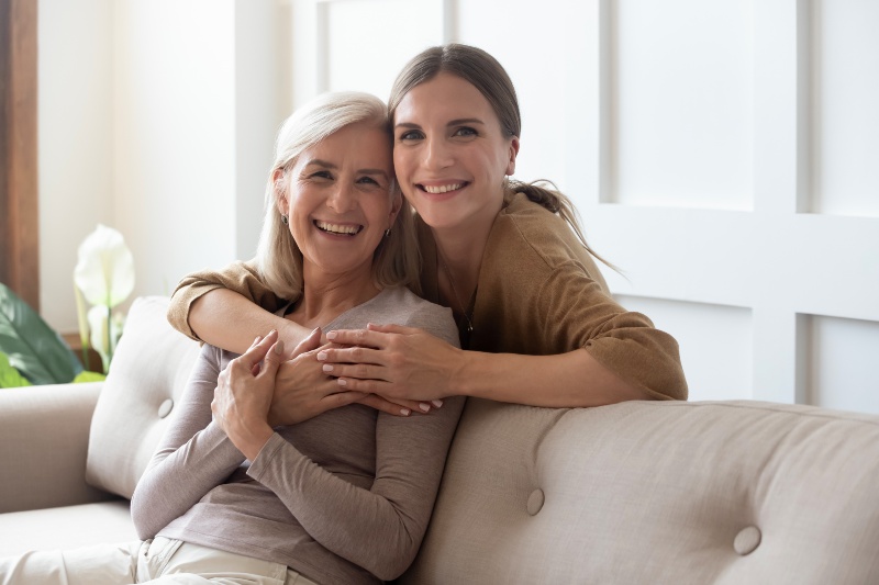 Daughter Hugging Elderly Mother | Things to Do When You Turn 50 Years Old
