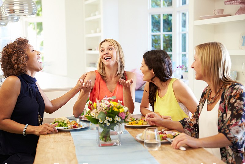mature female friends sitting around table | emotional detox meditation