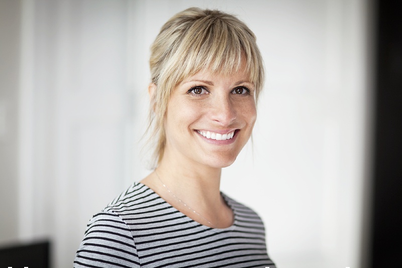 portrait mature woman smiling camera home | Sensitive teeth pain relief