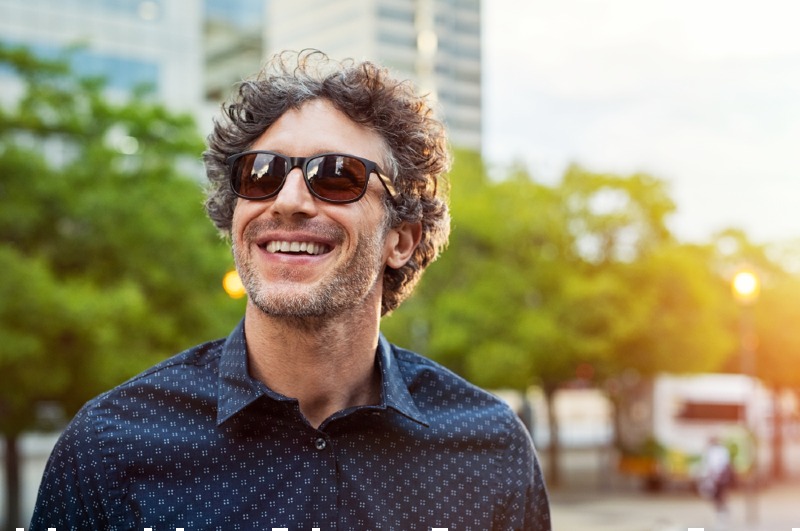 portrait smiling man wearing sunglasses looking | retirement age