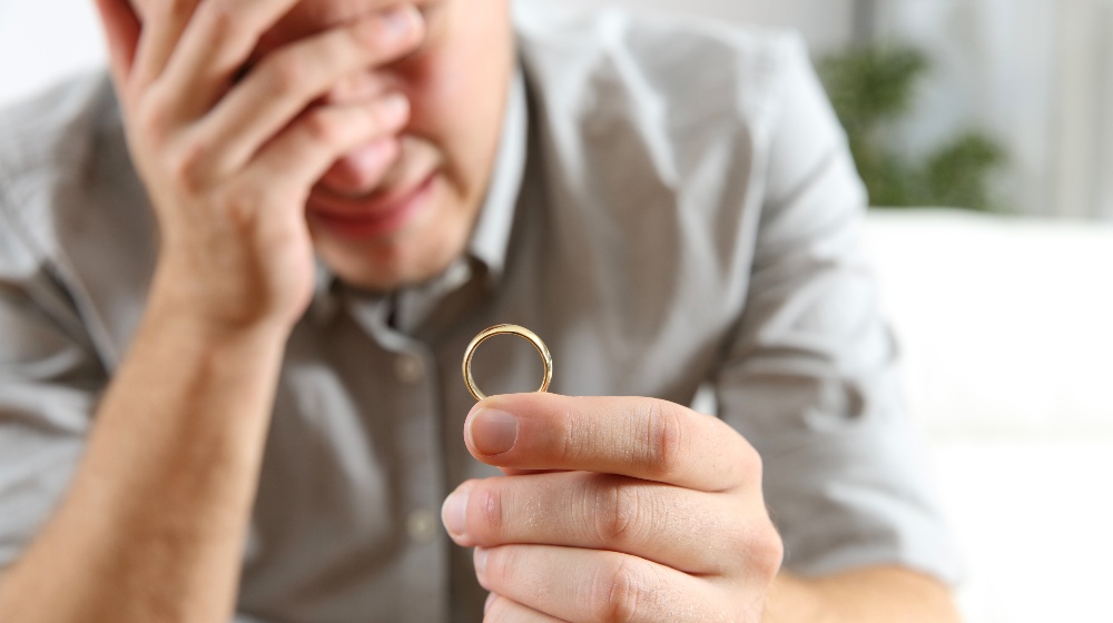 Sad Husband Holding the Wedding Ring | Featured