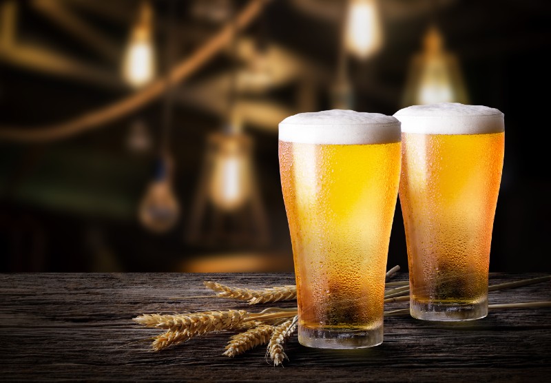 Two glass of beer with wheat on wooden table-Weight Loss