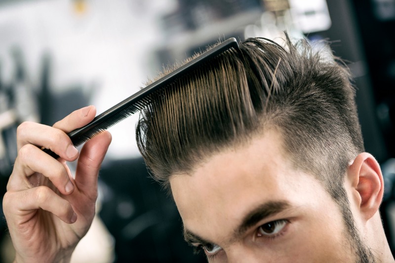 Man Combing Hair at Hairdresser | Hair Care Tips