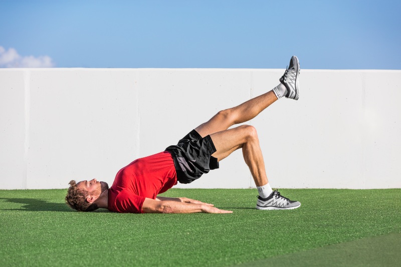 Man Doing Hip Bridge | Strength Training