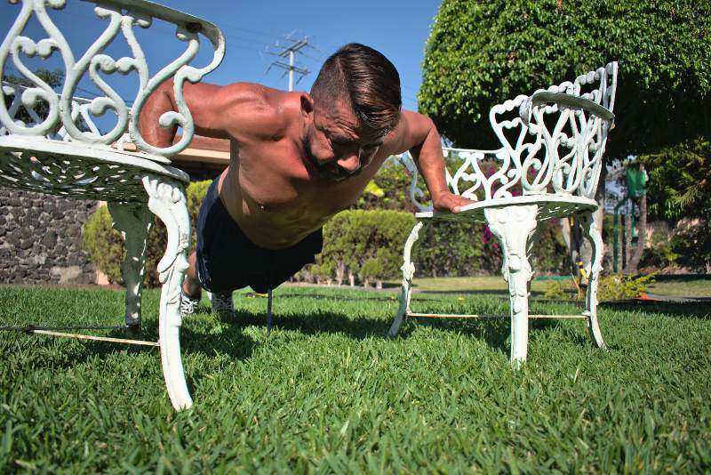 Man Doing Pushups with Two Chairs | Strength Training