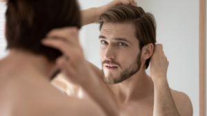 Man Touching Hair | Hair Care Tips | Featured