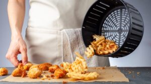 Woman Dumping Food from Basket | Keto Air Fryer Recipes | Featured