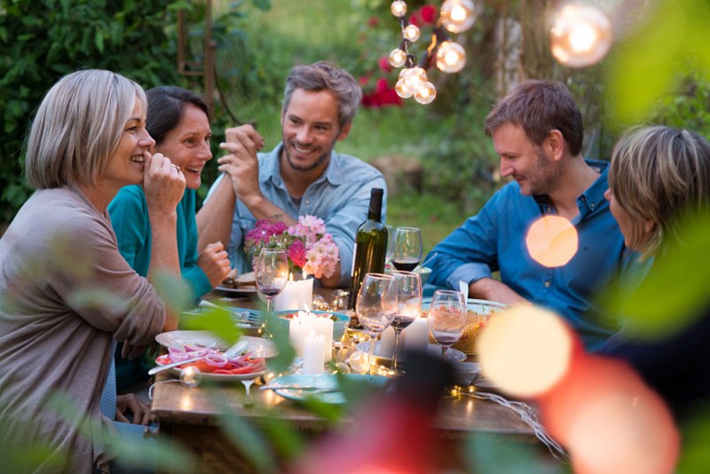 beautiful summer evening garden group friends | ways to improve your mental health