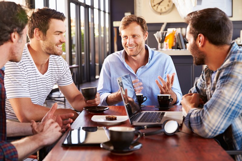 group men talking coffee shop | how to improve my mental health
