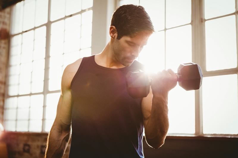 handsome man lifting dumbbell gym | dumbbell exercises for men