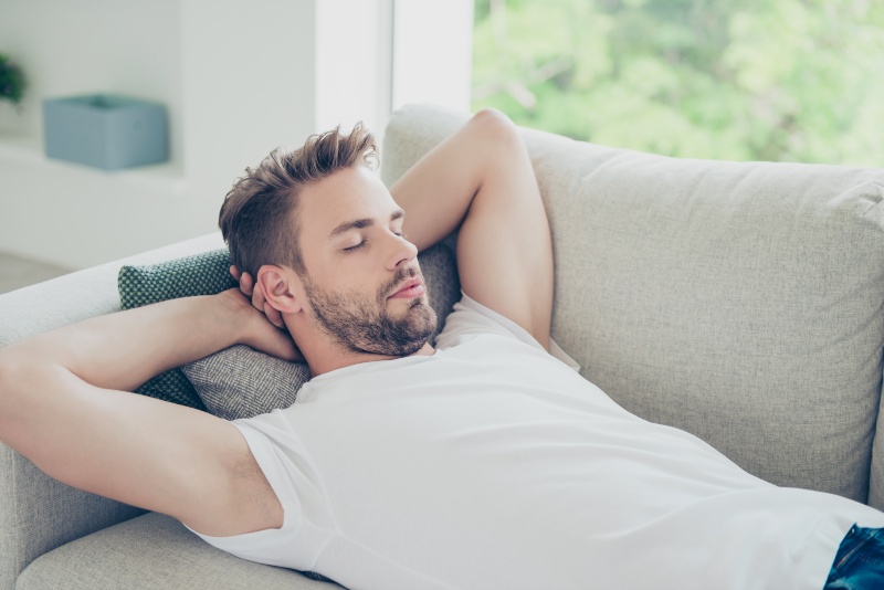 Man Sleeping on Sofa | Sleep Hygiene