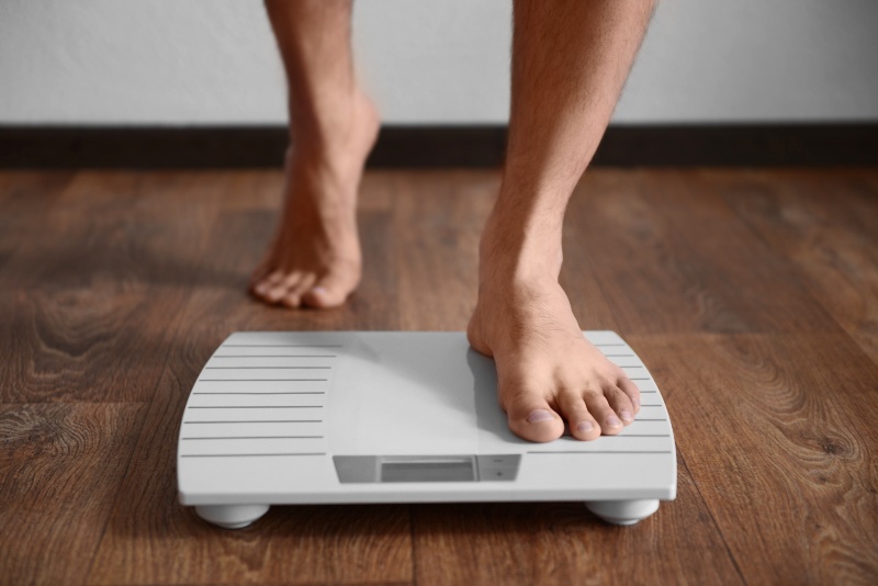 Man Standing on Weight Scale | Blood Sugar