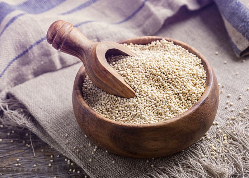 white quinoa seeds on wooden background | Super Foods to Lower Blood Pressure