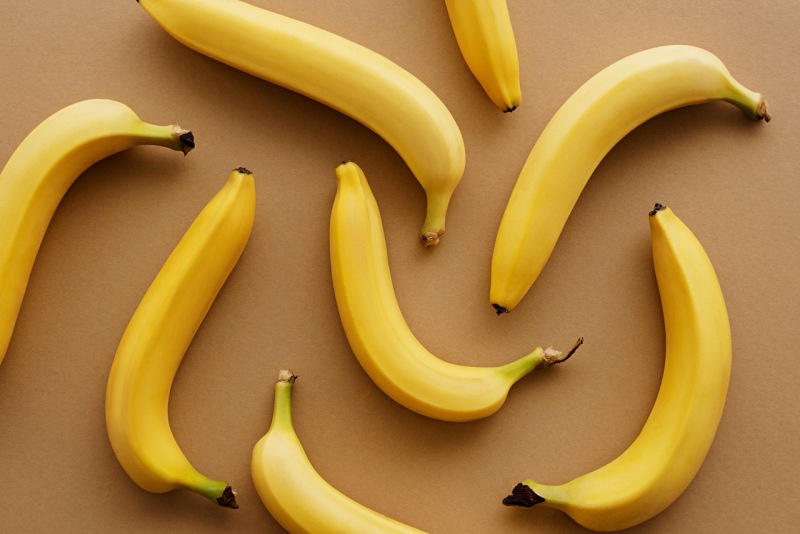 yellow banana fruits on brown surface | essential nutrients