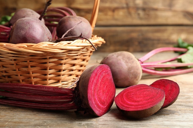 cut whole raw beets on wooden | liver cleansing foods