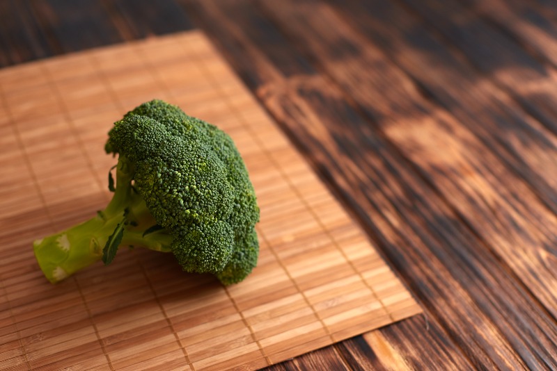 Fresh Green Broccoli on Wooden Background | Diindolylmethane