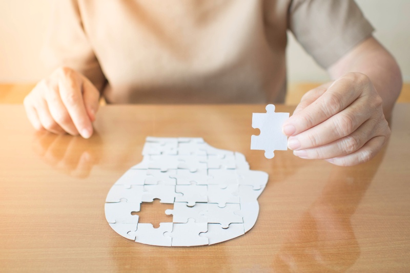 Hand Holding Missing White Jigsaw Puzzle Piece | CoQ10 Benefits