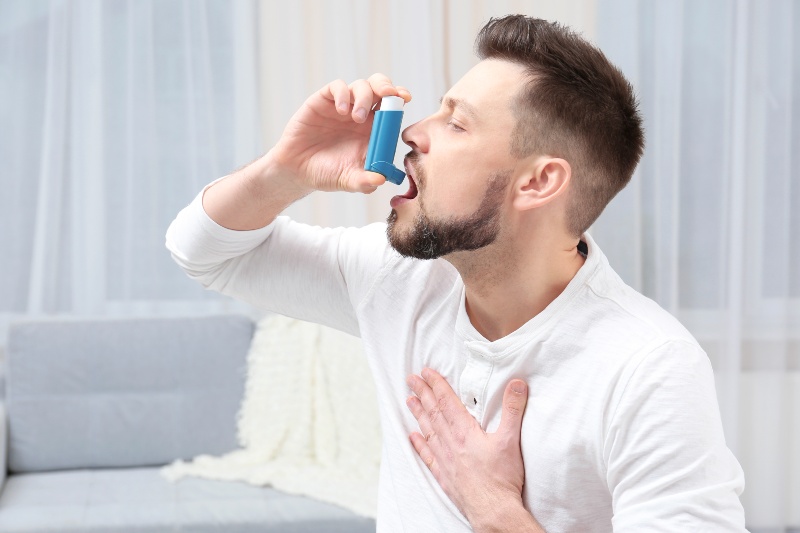 Man Using Asthma Inhaler | CoQ10 Benefits