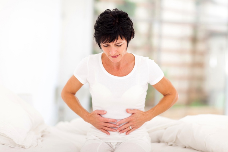 mid age woman having stomach pain |estrogen dominance symptoms