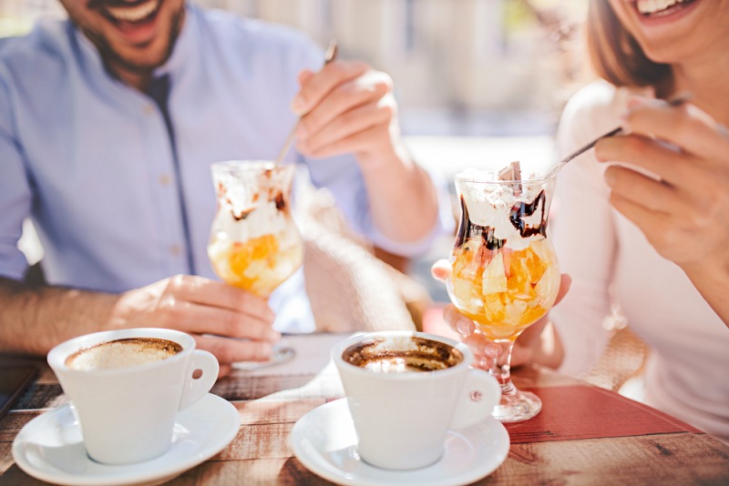 romantic couple drinking coffee enjoying fruit | inositol health benefits