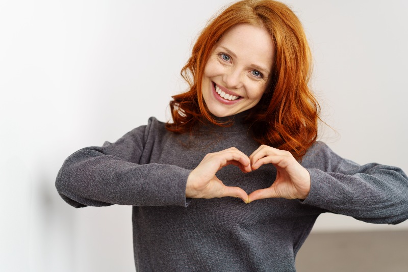 Woman Making a Heart Gesture | CoQ10 Benefits