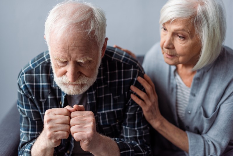 worried senior woman touching husband suffering from dementia-dementia