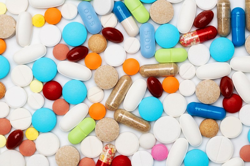 different colorful medication pills on white | medications that cause high blood sugar