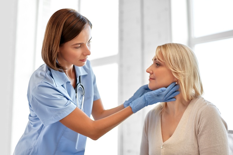 Nurse Checking Patient's Neck | Hyperparathyroid Symptoms