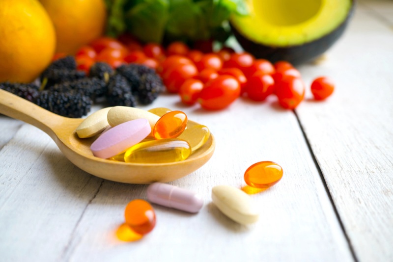 pills capsules wooden spoon fresh fruits | what is selenium