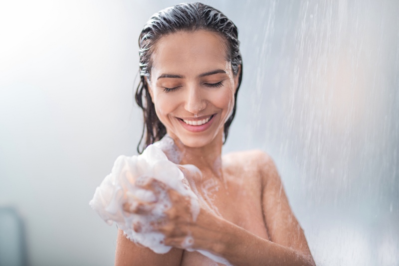 portrait happy girl taking shower gel | cold shower