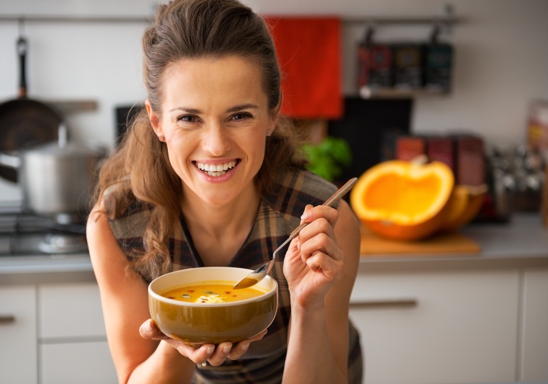 Woman Eating Pumpkin Soup | Menopause and Joint Pain