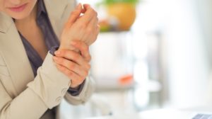 Woman with Wrist Pain | Menopause and Joint Pain | Featured