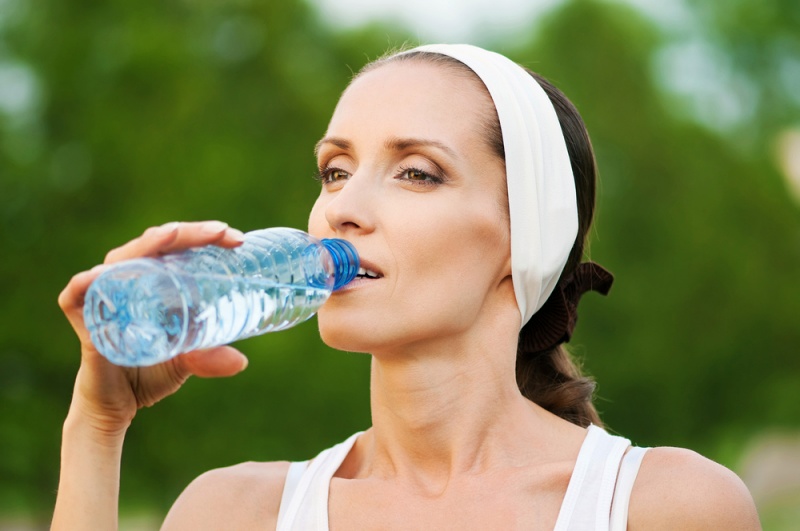 young woman drinking water after fitness | How to Improve Kidney Function in Elderly