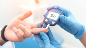 Doctor checking blood sugar level with glucometer | Top 10 Diabetes Herbal Treatments From Around the World | featured