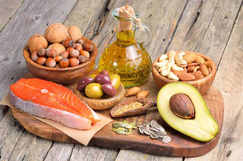 Selection of healthy fat sources on wooden background-Ketogenic Diet